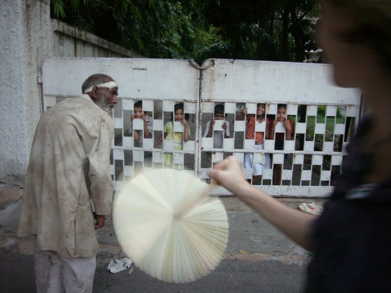 We handed out some chocolates. The kids wanted them but this old man got one instead. He barely had the strength to lift it to his lips.